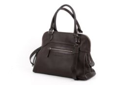 A brown leather Longchamp handbag.