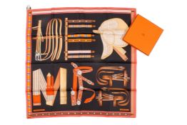 A Hermes Lettres Equestres orange silk scarf. Boxed with tag.