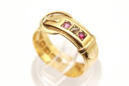 An 18ct gold buckle ring. Set with three small stones, hallmarked, size K, gross weight 3.5g.