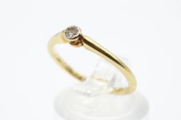 An 18ct gold and diamond solitaire ring.