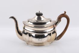 An early 19th century silver teapot.