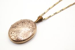 A 9ct gold chain with gold plated oval picture locket.