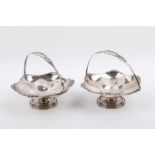 Pair of Stirling silver hallmarked bonbon dishes with swing handles.