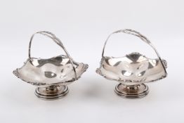 Pair of Stirling silver hallmarked bonbon dishes with swing handles.