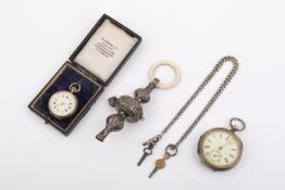 A group of silver and white metal items.