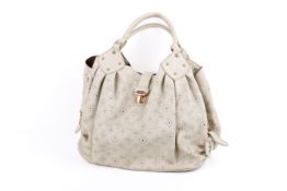 A large cream Louis Vuitton Mahina handbag.