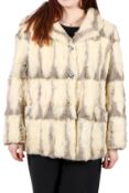 A vintage white and grey fur jacket, possibly mink, with twin pockets and buttons down the front,