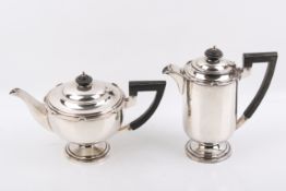 A matching Stirling silver hallmarked Walker & Hall teapot and water jug.