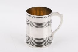 A Georgian Stirling silver Christening mug. Having tapering sides with a gilt interior, 'W.