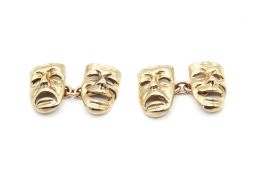 A pair of hallmarked 9ct gold cufflinks in the form of comedy & tragedy masks. 8.