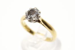 An 18ct gold diamond solitaire ring. The round cut diamond circa 1.