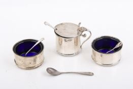 A Stirling silver hallmarked three piece cruet set with small spoons.