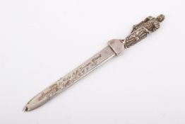 An Irish silver paper knife surmounted by a knight.