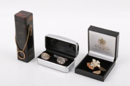 A 9ct stamped yellow metal mounted tortoise shell case, a single 9ct gold hallmarked cufflink 4.