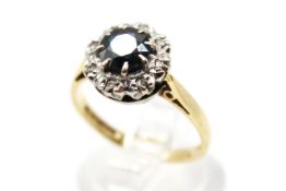 An 18ct gold sapphire and diamond cluster ring.