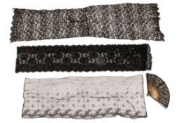 A 20th century fan and three lengths of black lace.