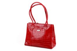 An Osprey of London red patent handbag.