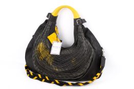 A Mariana Méndez black leather designer handbag.