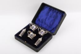 An early 20th century pierced silver cruet set.