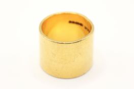 A wide 22ct gold ring. Undecorated, hallmarked, width 1.5cm, weight 18.7g.