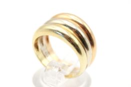 A tricolour gold ring. Graduated bands, marked 585 and tested as 14ct gold, size M, weight 5.5g.