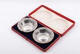 A pair of early 20th century pierced silver bonbon dishes.