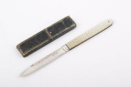A Georgian silver folding fruit knife with carved mother of pearl handle.