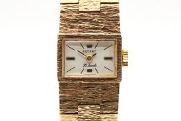 A 9ct gold Rotary cocktail watch. Gilt and black markers to the rectangular face, case circa 1.