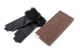 A pair of Ugg 'Gianna' black leather gloves with a fur cuff.