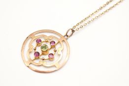 An Edwardian openwork pendant and attendant chain.