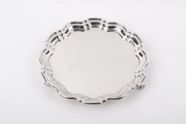 A Stirling silver hallmarked waiter with pie crust rim.