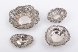 A collection of four assorted Stirling silver hallmarked pierced bonbon dishes.