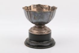 A small Stirling silver hallmarked 'rose' bowl on a black stand. A. & J.