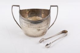 A Georgian Stirling silver hallmarked sugar bowl and a pair of sugar tongs.