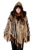 A Rizal France fur and leather poncho.