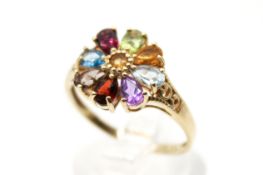 A hallmarked 9ct gold dress ring set with semi precious stones. To include quartz, topaz and garnet.