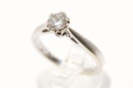 An 18ct white gold and diamond solitaire ring. Set with one round brilliant cut diamond of 0.