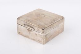 A Stirling silver hallmarked cigarette box. Vacant circular cartouche to the lid with wooden lining.