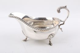 A Stirling silver hallmarked footed sauce / gravy boat.