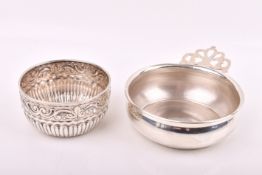 Two white metal shallow dishes.