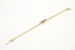 A hallmarked 18ct gold diamond set bracelet.