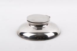 An early 20th century silver mounted weighted inkwell.