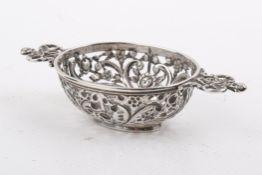 A small Victorian Stirling silver hallmarked pierced miniature basket.