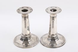 A pair of George V Stirling silver hallmarked weighted candlesticks.