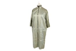 A Middle Eastern green and gold silk tunic.