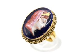 An early Victorian dress ring set with an oval painted miniature of a female bust in profile.