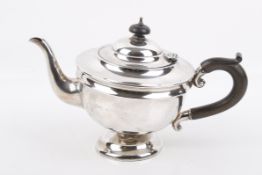 An early 20th century silver teapot.