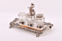 A William IV Stirling silver hallmarked desk stand with three glass containers.