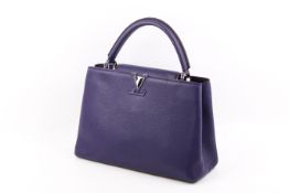 A Louis Vuitton Capucines MM shoulder bag.