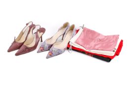 Two pairs of ladies designer shoes and a selection of designer cloth bags.